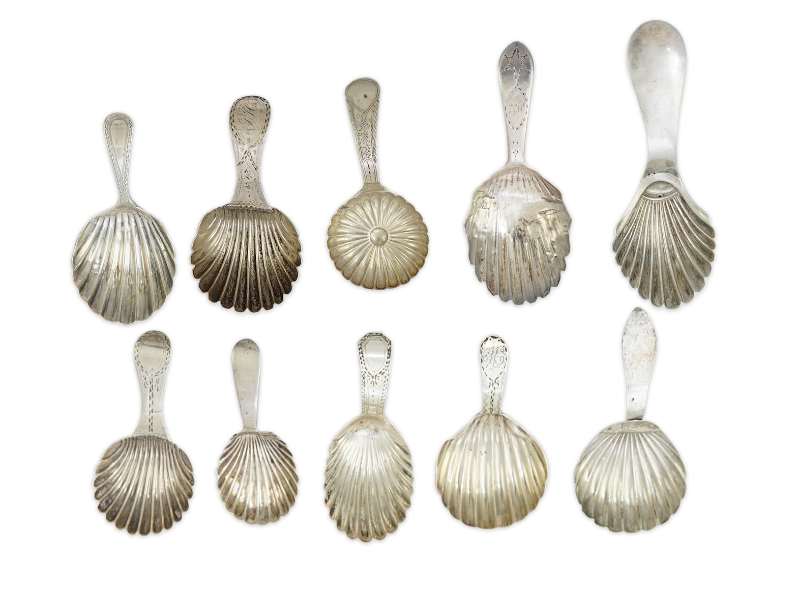 Ten assorted mainly 19th century silver and white metal caddy spoons, with shell or fluted bowls
